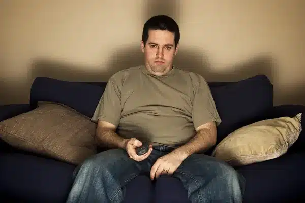 depositphotos 19311839 stock photo bored overweight man sits on